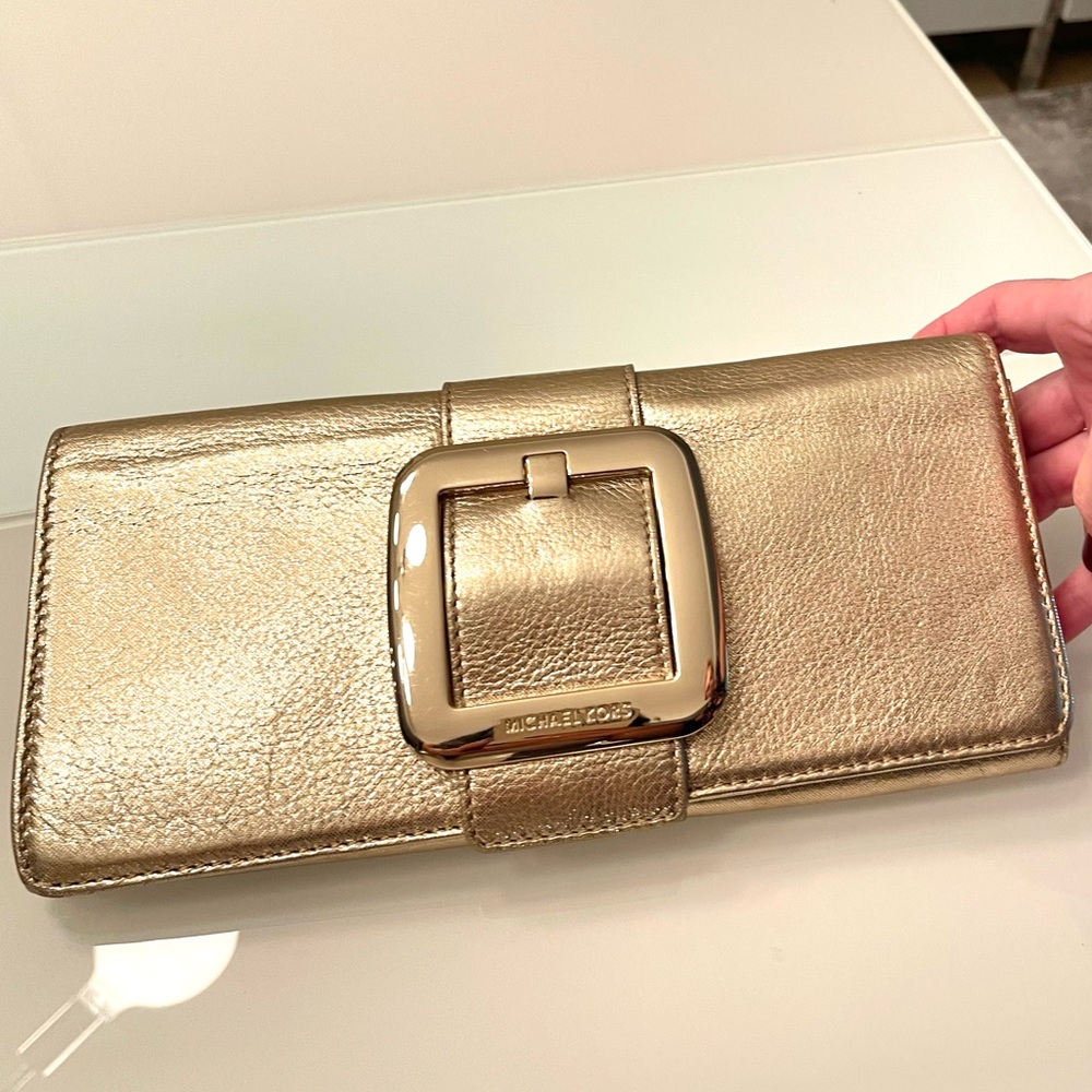 Brand NEW Micheal Kors clutch bronze color